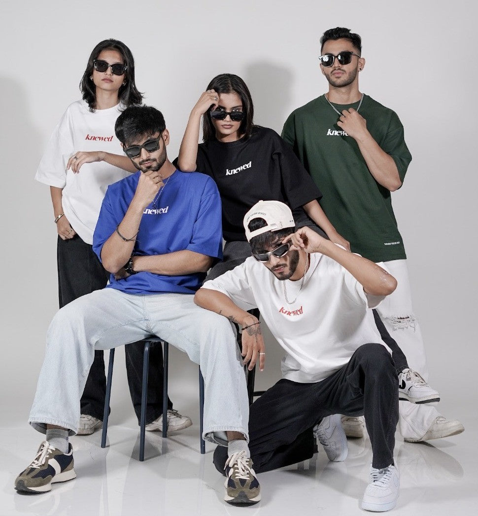 Five models wearing Knewed oversized tees